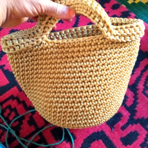 handmade crocheted or knitted handbag